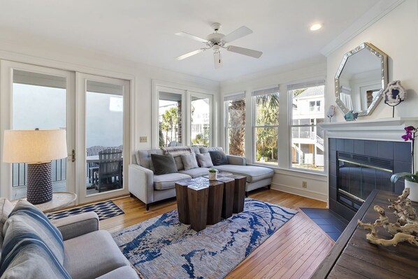 Beautiful open and bright living room with lots of seating.