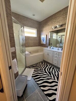 Primary bathroom - walk in shower, double vanity, separate toilet & bath tub.