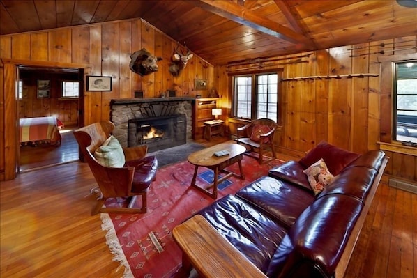 Living area with fabulous stone wood burning fireplace, Great vintage furniture