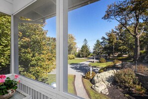 view of driveway from unit 2 porch