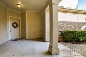 Covered main entrance with keypad access.