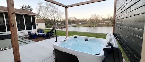 Relax in the hot tub while looking out over Old Hickory Lake