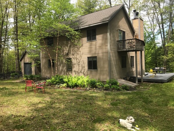 ONE CLOVEWOOD sits on three acres with a large L-shaped deck and small balcony