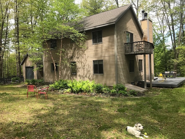 ONE CLOVEWOOD sits on three acres with a large L-shaped deck and small balcony