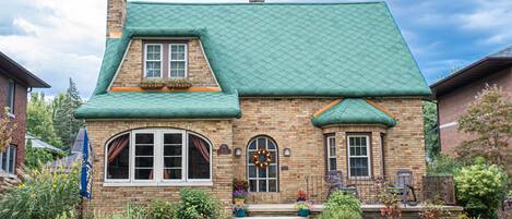 Enjoy sitting on the porch watching fellow  football fans walk to the game!