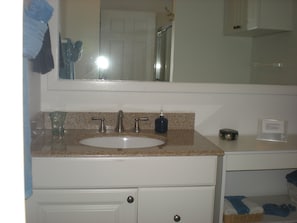 bathroom with tub/shower combo upstairs