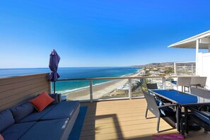 Spacious deck with panoramic 180 degree views, comfortable seating and BBQ