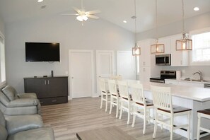 Great room - Cabinet under the TV is a queen size murphy bed