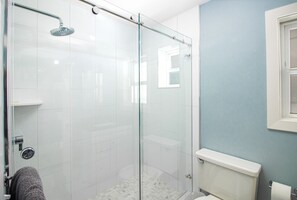 Modern, sliding door shower enclosure