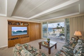 living room showing queen-size wall bed closed