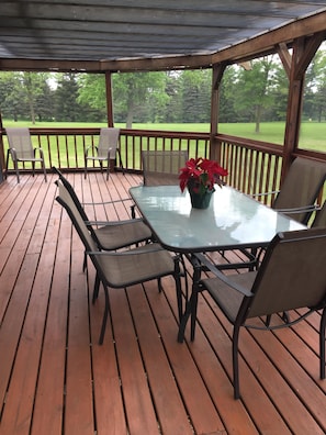 Screened in deck with seating