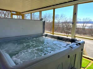 Hot tub is inside the downstairs screen porch