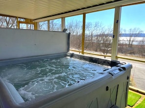 Hot tub is inside the downstairs screen porch