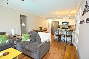 Bungalow living room with view of kitchen.