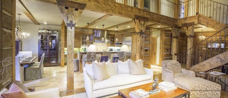 Warm and inviting living room opens to the kitchen and dining area.