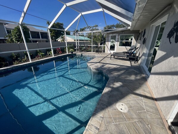 Resurfaced wet edge pebble/glass heated pool. 