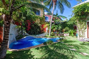 Private Topical Pool area with lush garden, hanging bed and with shady patio BBQ