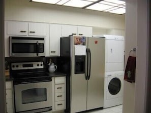 Kitchen has full size washer/dryer and refridge with ice maker in door.