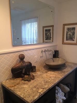 bathroom w/ vintage clawfoot tub and shower.