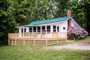 Front view of the cottage.  Deck built in 2016 with child/pet safety gate.