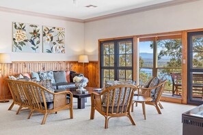 Open plan living area with lake views and fireplace!