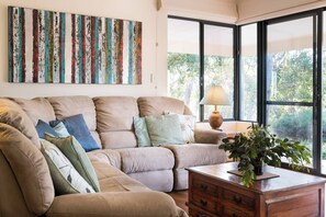 Get cosy in the second living area with reclining sofas and a wood-burning fireplace, ideal for quiet evenings with a glass of local wine and a good book.