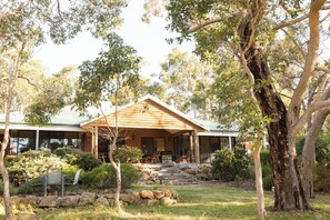 Arrive at a peaceful rural retreat where a classic brick façade, framed by native bushland, reflects the natural charm and beauty of Yallingup.