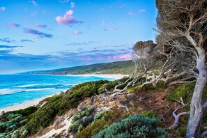 Wax up your board, slip into your wetsuit, and walk out the front yard onto the Yallingup Beach steps.