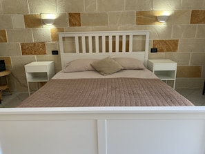 Spacious main bedroom with feature wall lights 