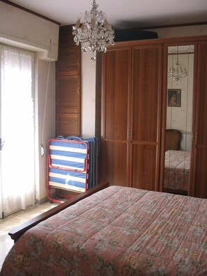 Built in oak storage units and extra pull-out single bed in Master Bedroom