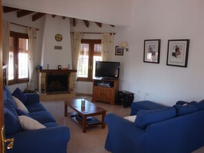Spacious Lounge with seating for six and open Fireplace.  TV, DVD, and PS2