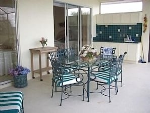 Outside dining area under lanai, seats 6. Electric Jenair BBQ, sink and coal BBQ