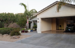 A golf cart is included as part of your stay, which leaves room for one car.