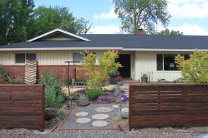 Neighborhood has wide streets w/ ranch style homes, gardens & plentiful parking.