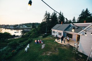 A large deck on the front of the house is perfect for the 180 degree view