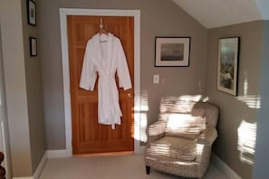 Two complimentary cotton guest bathrobes.