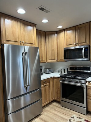 All New stainless appliances with 5 Burner Gas Range