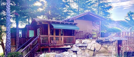 Cabin overlooking swimming pool and patio