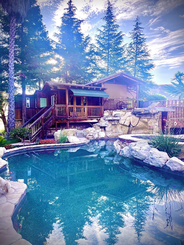 Cabin overlooking swimming pool and patio