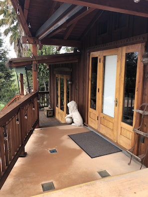 Bedroom and living room doors open to deck looking over the pool