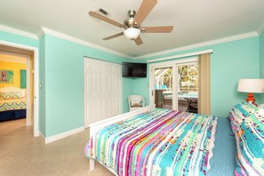 Master bedroom with slider to pool/lanai and Tiki Bar.  King size Bed.