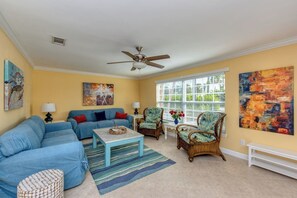 Open space living room with lots of comfy seating.