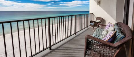 Watch the waves from our generously sized balcony, angled to watch the sunsets.