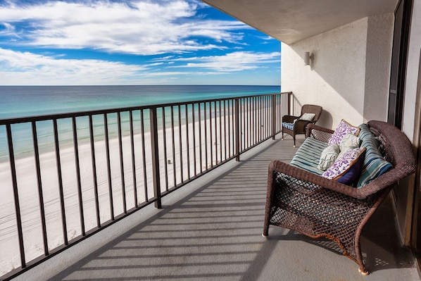 Watch the waves from our generously sized balcony, angled to watch the sunsets.