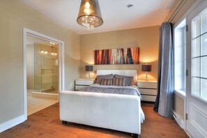 Master bedroom with bathroom ensuite,  a huge glass shower and a walk in closet.