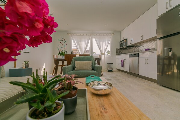 Comfortable 
living room and modern new kitchen 
