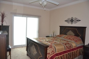 Direct access to beachfront balcony from master bedroom with lavish queen bedl