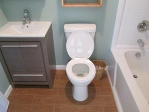 NEW BATH WITH A NEW PORCELAIN TILE FLOOR / NEW CUCTOM VANITY / NEW TUB/SHOWER