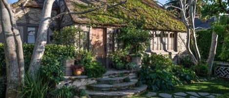 Front View of the Charming Tudor Cottage reminiscent of aThomas Kinkade painting