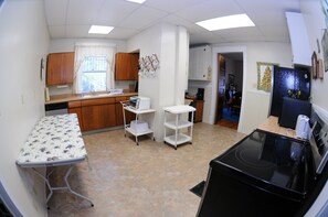 Large, open kitchen with carts that can be work tables, or used to transport.